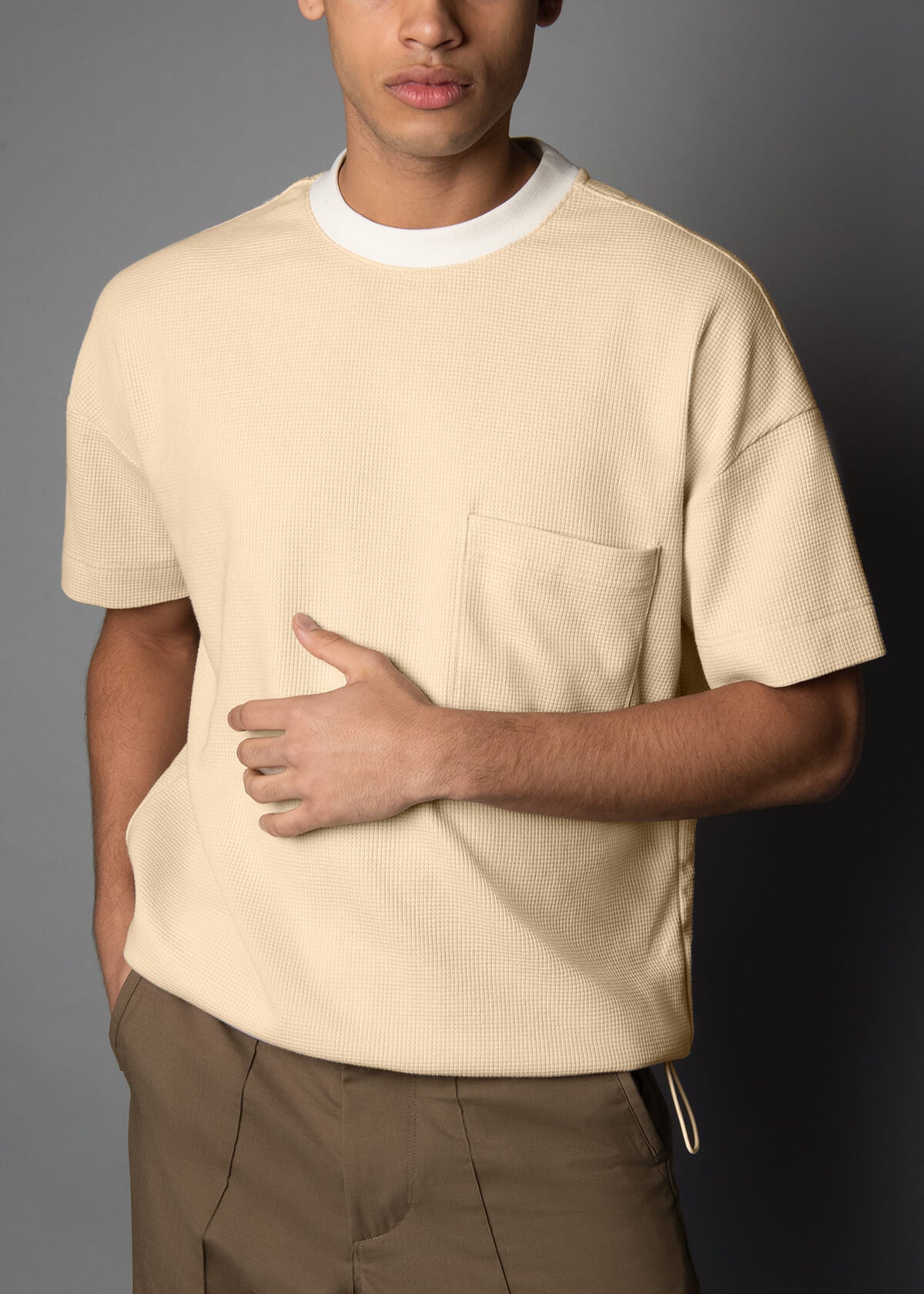 cream colored mens tee with a crew neck